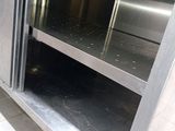 a stainless steel oven with a door open in a kitchen