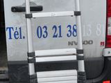a van that has a ladder in the back of it