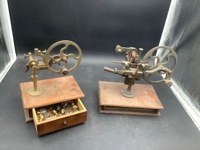 two small machines that are on display in a glass case