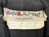 a label on the back of a sweater that says saint laurent