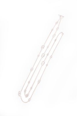 a drawing of a necklace and a pair of earrings on a white surface