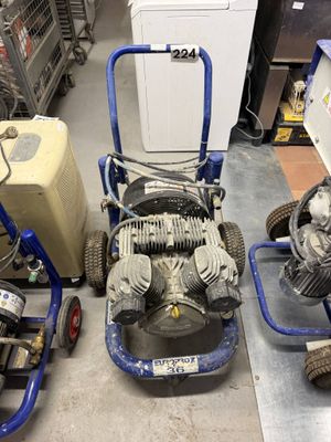 two machines sitting next to each other on the floor