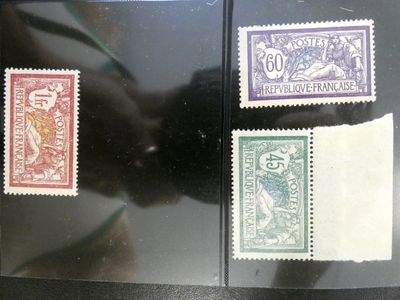 three different types of stamps are on a black surface