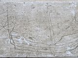 a stone plaque with a drawing of a boat on it
