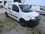 a small white van parked in a parking lot