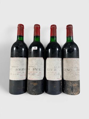 trois bouteilles de vin sont alignées sur une surface blanche