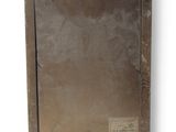 an old picture of a brown wooden frame with a label on it
