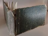 an old book that has been left open on the table