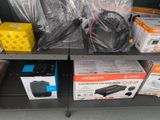 many boxes of electronics on a shelf in a store