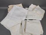 several pieces of white handkerchiefs on a gray surface