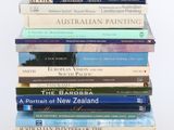 many books stacked on top of each other on a table