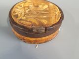 a small wooden box with a picture of a woman on it