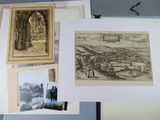 many pictures of a picture of a city on a table