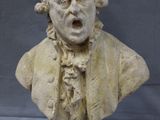 an image of a bust of a man with a surprised look on his face