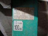 a label on the side of a machine that is sitting on the floor
