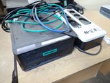 a table with a lot of wires and a remote control