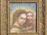 an old picture of a painting of the virgin and child