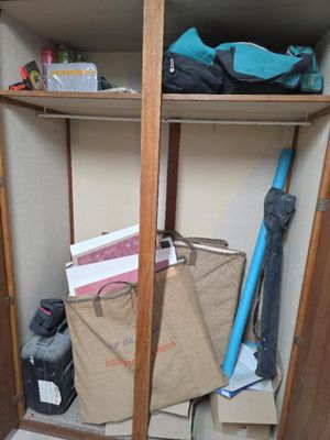 a small closet with a lot of items in it