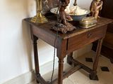 a small table with a lamp on top of it