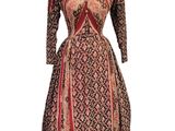 a dress on a mannequin mannequin with a red and black pattern