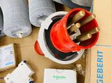 a box full of wires and other electrical equipment on the floor