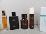 several different types of perfumes are lined up on a table