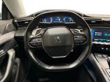 the interior of a car with a steering wheel and dashboard controls