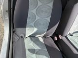 a car with a seat cover in the back of it