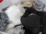 a basket full of clothes and other items that are in it