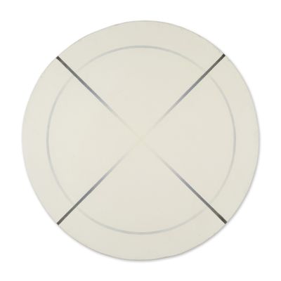 a white plate with a cross on it on a white surface
