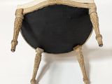 a black and white chair that is on a white surface