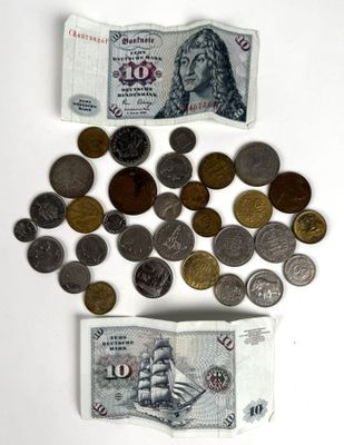 a lot of coins and a note on the table