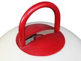 a red handle on a white object on a white surface