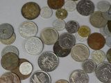 a lot of coins that are on the table