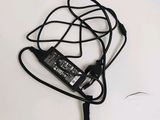 a picture of a laptop charger with a cord attached