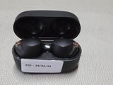 an image of a pair of black earphones sitting in a case