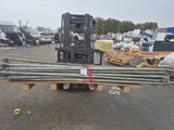 a forklift with a bunch of steel rods on the back of it