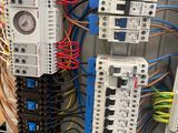 an image of a bunch of electrical wires and wires in a cabinet