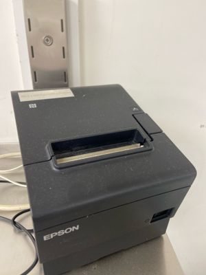 a close up of a printer sitting on top of a counter