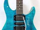 a blue electric guitar sitting on top of a white background