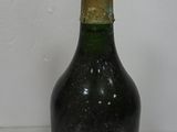a bottle of wine that has been left on the table