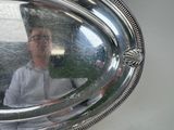 a reflection of a man in a mirror on a wall