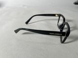 black glasses on a table with a white table cloth
