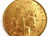 l'image d'une pièce d'or sur laquelle figure le visage d'une femme