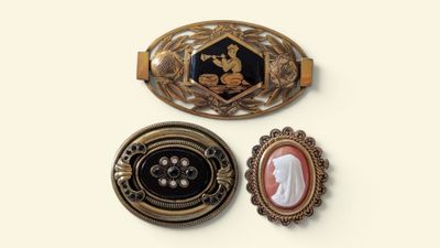 three different types of brooches on a white surface