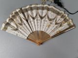 a fan that is sitting on a table next to a cord