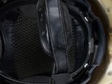 the helmet of a soldier is shown with a pair of headphones