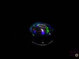a close up of a glass object with a black background