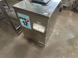 a large machine that is sitting in a kitchen