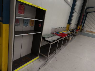 a room with a shelf and a bookcase in it